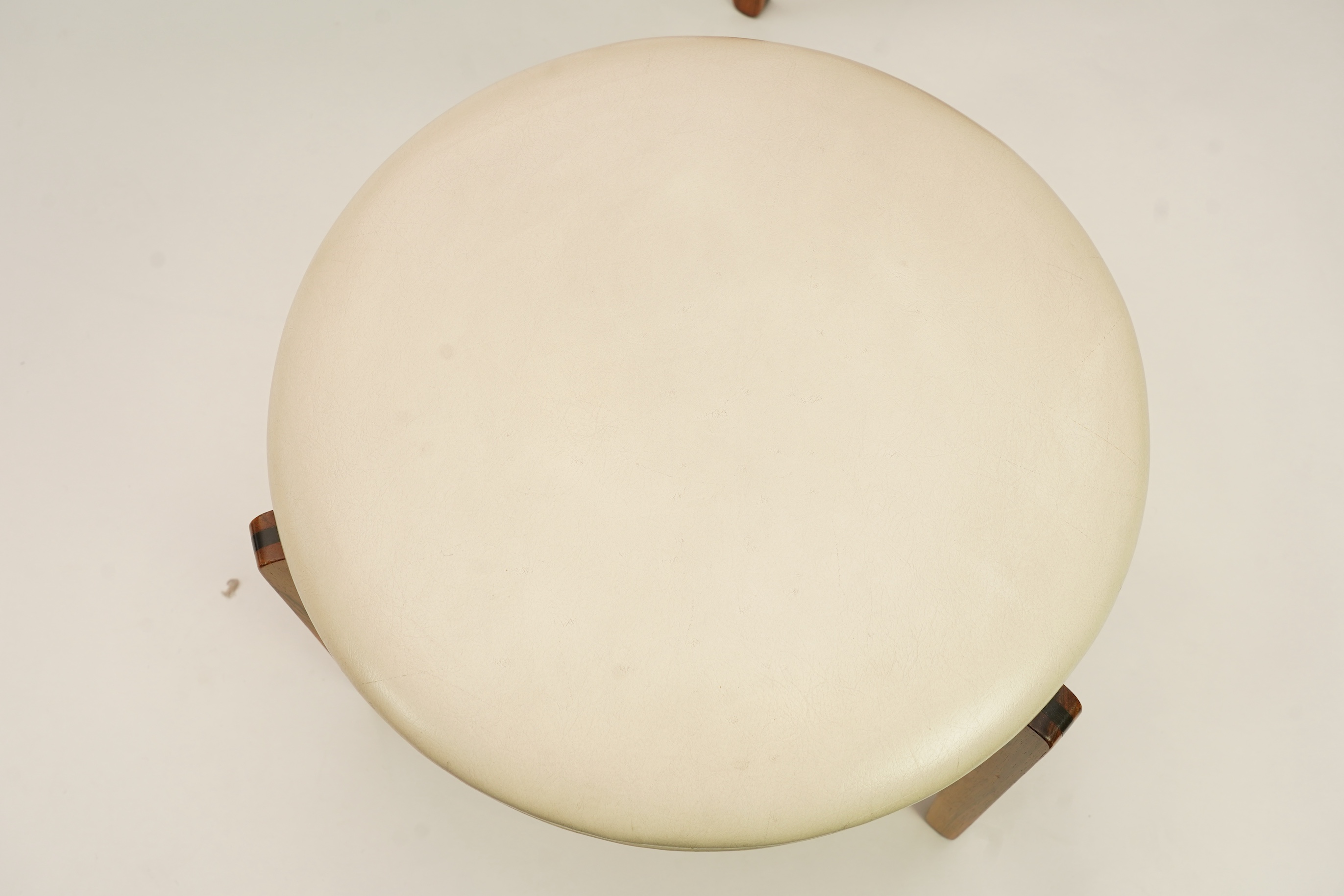 Sven Ellekaer (Danish, 1926-1984) for Christian Linneberg Møbelfabrik: A coffee table and three nesting stools ensuite